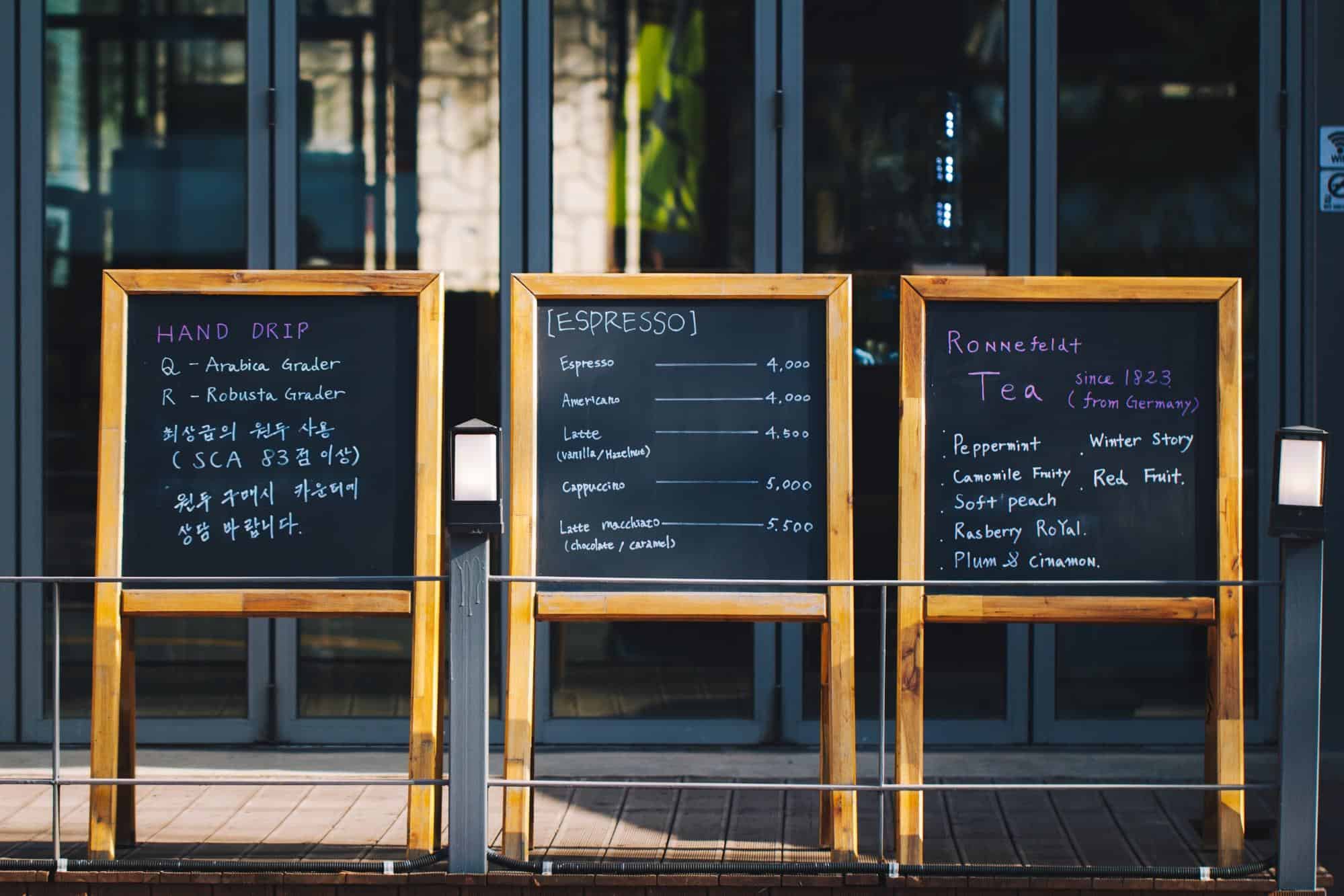 Chalkboards showing restaurant menu.