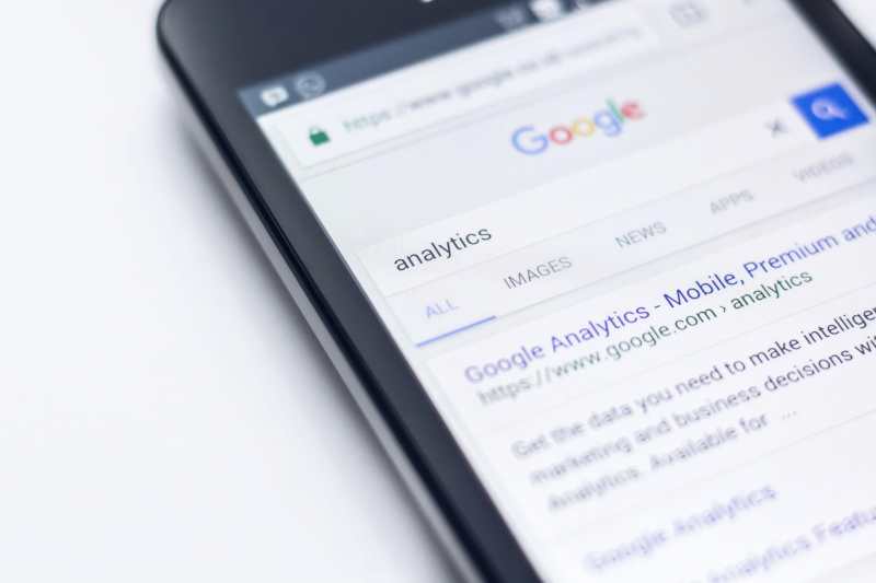 Google analytics is displayed on a cell phone.