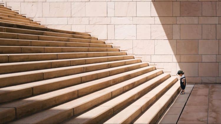 image4 A person standing on the steps of a building.