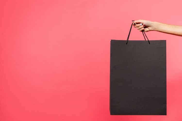 woman-holding-shopping-bag woman holding shopping bag