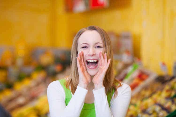 woman-shouting-offers-on-grocery-store woman shouting offers on grocery store