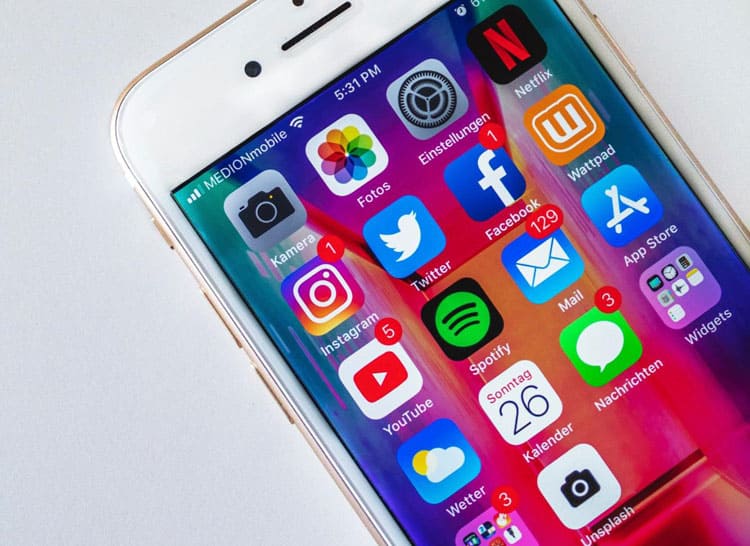 An iphone with a variety of apps on it.