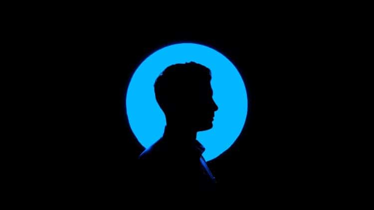 Silhouette of a man against a blue background.