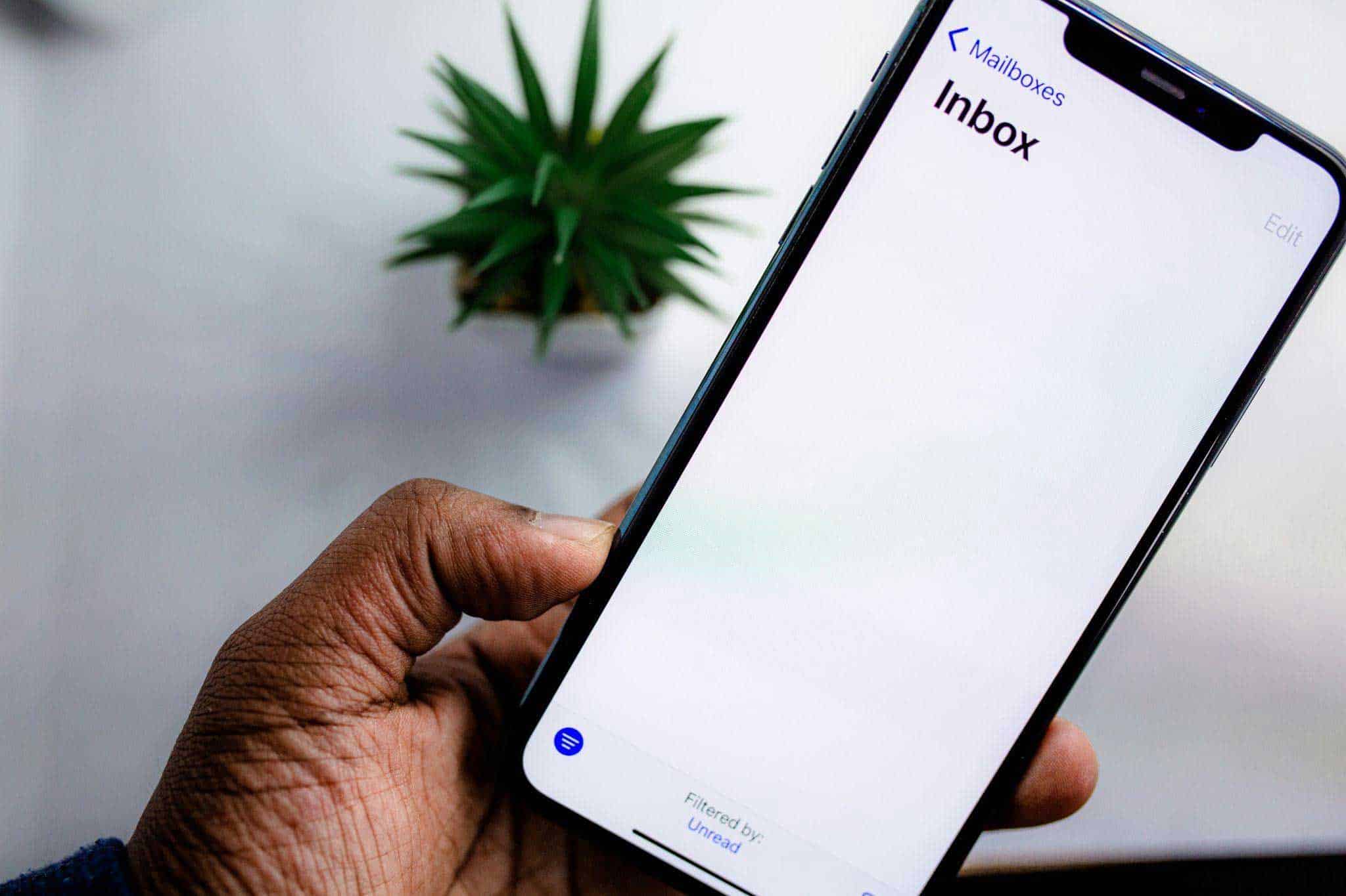 man opening email in mobile phone
