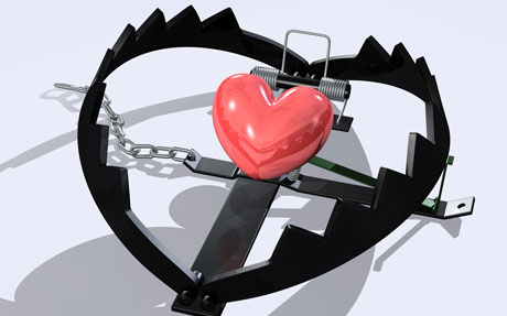 A heart with a chain attached to it.