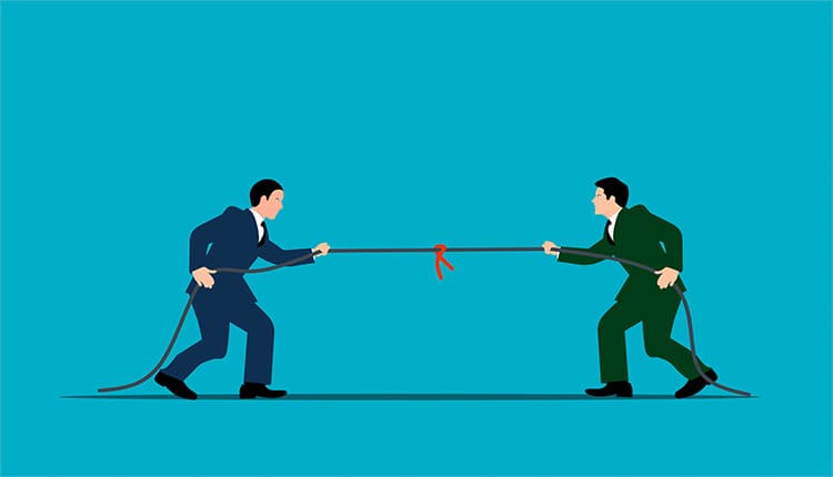 Two businessmen pulling a rope.