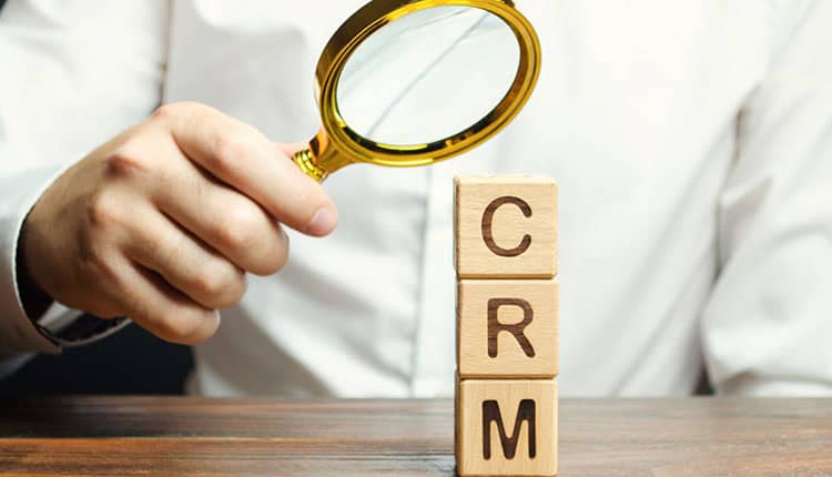 Wooden blocks with the word CRM (Customer Relationship Management) 